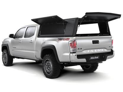 Hardtop Alu-Cab "Guard" pour Toyota Tacoma 2016-2023, texture en aluminium robuste, vue en gros plan sur le modèle.
