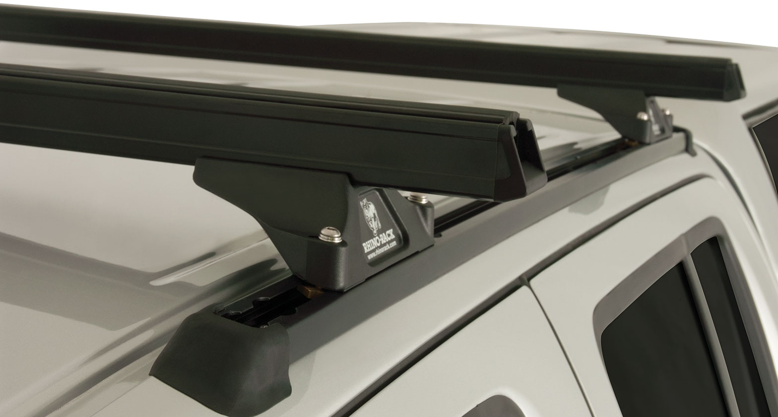 Kit 2 barres de toit noire 1375mm Heavy Duty RLTP Trackmount Nissan Navara D40 2005-2015 - RHINO-RACK sur Xperts4x4 Accessoires 4x4 Off-Road